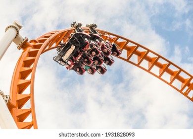 Coney Island, USA - October 25, 2015: people enjoy riding the roller coaster at Coney Island, the amusement beach zone of New York.