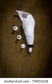 Confectionery Bag With Attachments On A Wooden Table