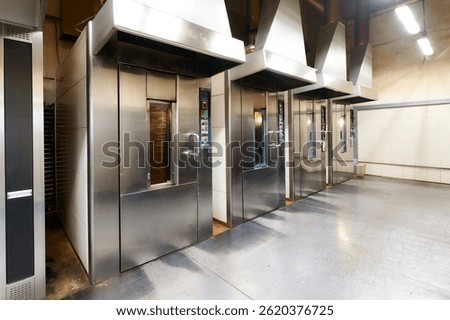 Confectionery baking oven setup with multiple rotary rack ovens in a modern commercial kitchen environment