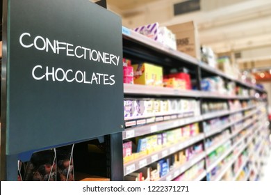 Confectionery And Chocolate Signage Grocery Categoy Aisle At Supermarket