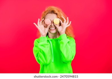 Confectionery. Sweet French macaroon. Sweet tooth. Yummy. Woman with yummy cookie. Woman with macaron dessert isolated on pink. Woman hold French macaron. Macaroon cookie. Sweet macaron - Powered by Shutterstock