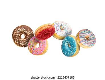 Confectionery as sweets and doughnuts collage isolated on white background. Colourful donuts flying over white with clipping path. Full Depth of field.