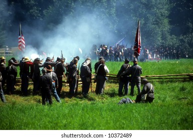 Confederates Volley Fire On Advancing Union Soldiers,		Civil War Battle Reenactment