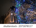 Confederation Square with festive Christmas Lights during winter with Central Post Office clock in the background, corner of Sparks Street and Elgin Street, Ottawa, Ontario, Canada. Photo taken in Dec