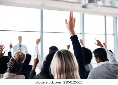 Conference, convention and business people with hands for a question, vote or volunteering. Corporate event, meeting and hand raised in a training seminar for questions, voting or audience opinion - Powered by Shutterstock