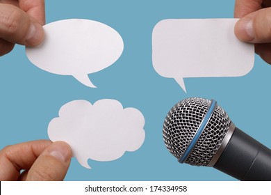 Conference, Interview Or Social Media Concept With Microphone And Blank Speech Bubbles