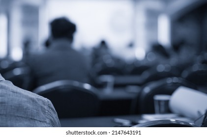 Conference Photo Audience And Speaker Giving Speech. Seminar Presenter On A Panel During Forum. Corporate Manager In Sales Executive Training Discussion On Stage. Investor Pitch Presentation.
