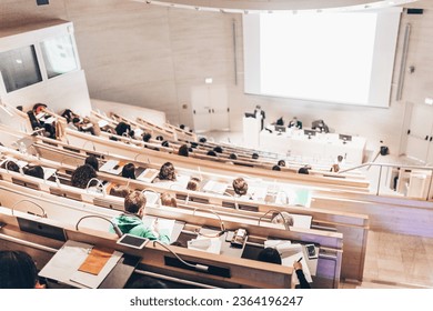 Conference and Presentation. Audience at the conference hall. Business and Entrepreneurship. Faculty lecture and workshop. Audience in the lecture hall. Academic education. Student making notes. - Shutterstock ID 2364196247