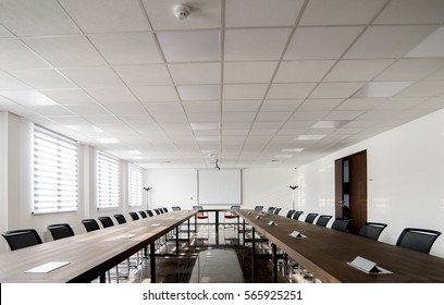 Conference Room Interior With Empty Chairs And A Projector Screen