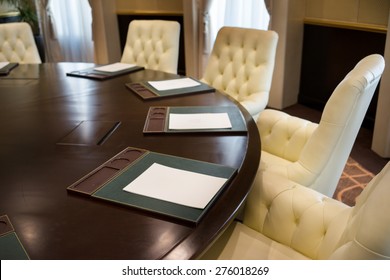 Conference Round Table And Office Chairs In Meeting Room