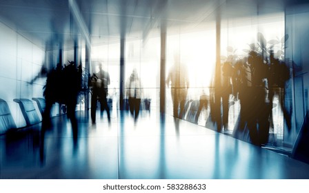 Conference Table And Chairs With Blurred Business People 