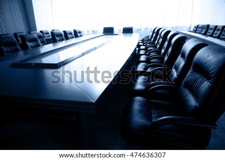 Conference table and chairs in meeting room 
