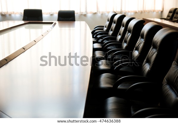 Conference table and\
chairs in meeting room\
\
