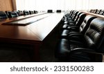 Conference table and chairs in modern meeting room.