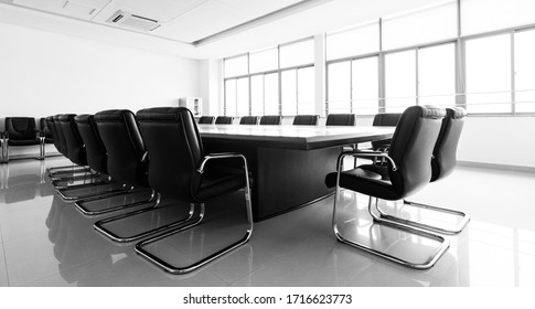 Conference table and chairs in modern meeting room.