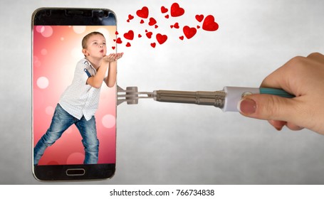 Confession In Love. The Boy Sends Hearts Through The Phone Screen .