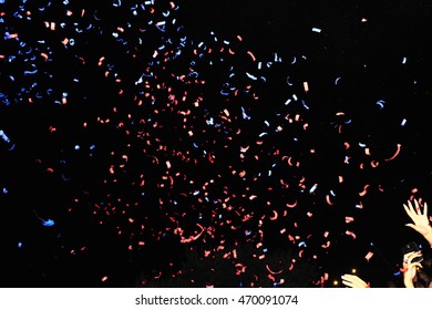 Confetti fired in the air during a beach party