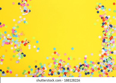 Confetti On Yellow Background