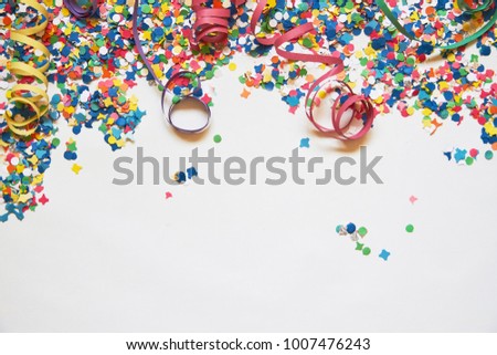 confetti and serpentine on a white background. Carnival. Abstract frame for text. holiday, birthday, anniversary, greeting card
