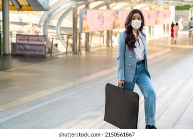 Confidence Asian Businesswoman Office Worker Wearing Face Mask Walking Up Staircase At Railway Station Urban City In Morning Rush Hour. Business Woman Go To Working At Office Building District.