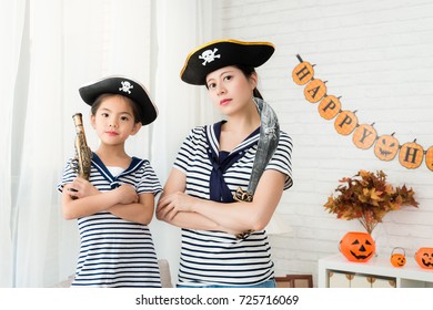 Confidence Captain Girl And Crew Mother Play The Pirate Game Face To The Camera For Halloween Holiday