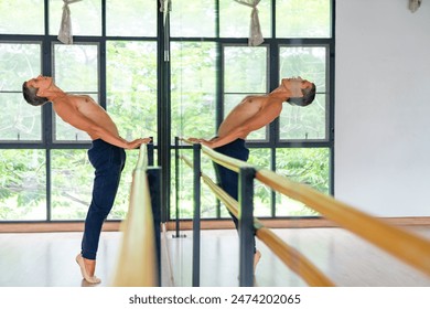 Confidence Caucasian male ballet dancer practicing ballet dance alone in studio room. Handsome man athletic dancing classic ballet showing performance body stretching and strength muscle. - Powered by Shutterstock