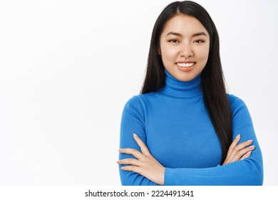 Confidence. Smiling Young Asian Woman In Power Pose, Cross Arms On Chest With Confident Face, Self-assured Look, Stands Over White Background.