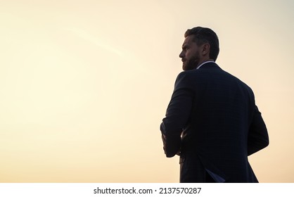 confidence and success. concept of successful future. agile business. loneliness. need the inspiration. man feel motivation. copy space. businessman silhouette on sky background