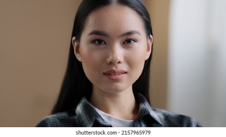 Confident 20s Girl 30s Asian Ethnic Woman Perfect Skin Face Looking At Camera Posing Alone At Home In Office Millennial Korean Ethnicity Student Professional Female Worker Close Up Front Portrait