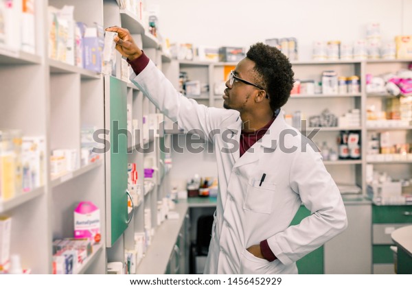 Confident African American Man Pharmacist Standing Stock Photo (Edit