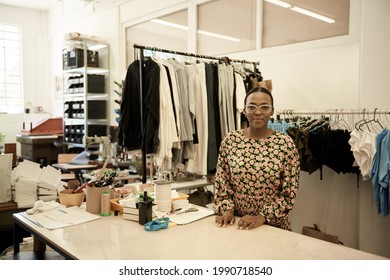 Confident African Female Fashion Designer Working In Her Studio