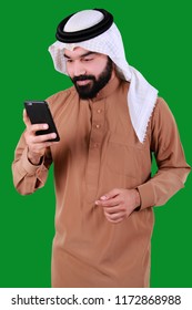 Confident Arab Man Using Mobile Phone And Smiling 