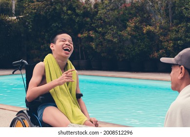 Confident Asian Disabled Child On Wheelchair And Adult With Fun On Swimming Pool Background, Concept The Exercises For The Strength Of Muscles With Disability Person.