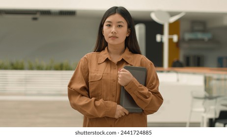 Confident Asian ethnic businesswoman portrait serious chinese korean girl designer female entrepreneur cafe owner small business elegant Asia woman client hold tablet computer digital device in office - Powered by Shutterstock