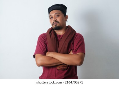 confident asian man with crossed arms isolated in white background