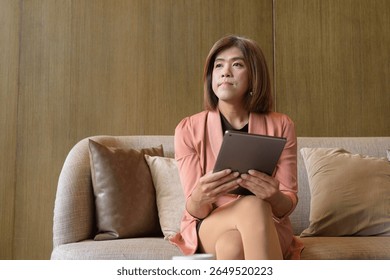 Confident Asian transgender non binary person in business attire at stylish indoor cafe restaurant - Powered by Shutterstock - Get 15% off with code: PIKWIZARD15