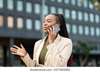 Confident Black Woman Entrepreneur Talking On Phone Outdoors - Powered by Shutterstock