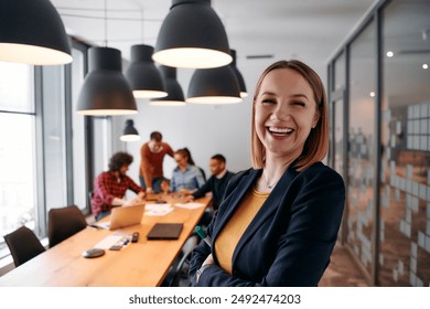 Confident Blonde Businesswoman Leading Team in Modern Office Setting. - Powered by Shutterstock