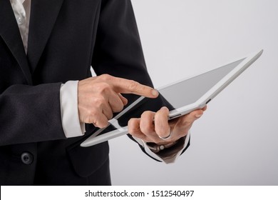 Confident Business Expert. Confident Young Handsome Man In Shirt And Tie Holding Ipad And Standing On White Background