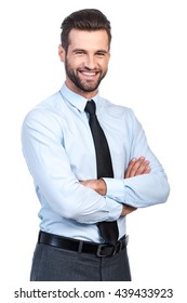 Confident Business Expert. Confident Young Handsome Man In Shirt And Tie Keeping Arms Crossed And Smiling While Standing Against White Background 