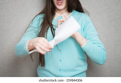 Confident business lady. Furious young woman tearing up paper 