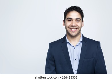 Confident Business Man Smiling On Grey Background