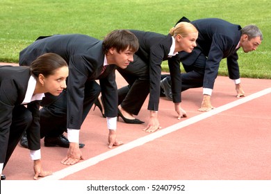 Confident business people lined up getting ready for race - Powered by Shutterstock