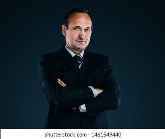 Confident Businessman Isolated On A Dark Background.