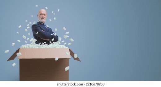 Confident Businessman Posing With Arms Crossed In A Delivery Box, New CEO Concept