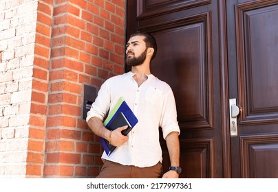 Confident Businessman In White Shirt Near Office Door. Guy With Documents. Man Self Employed