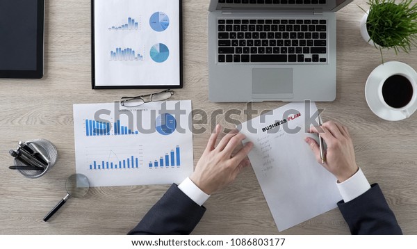 Confident Businessman Writing Business Plan New Stock Photo - 