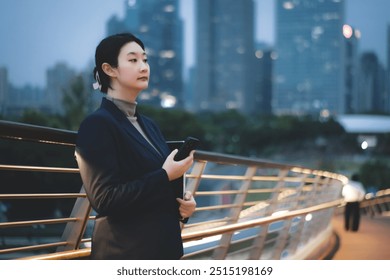 Confident Businesswoman Posing in a City Skyline at Dusk - Powered by Shutterstock