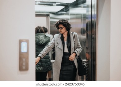 Confident businesswoman in stylish clothing pressing an elevator button as people wait inside the lift in a contemporary office setting. - Powered by Shutterstock