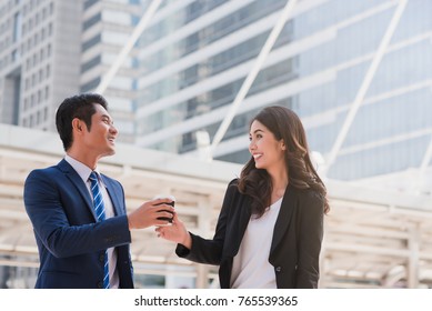 Confident businesswoman talking with businessman. Successful business people drink coffee after good deal with partnership  after making agreement. business meeting and agreement concept